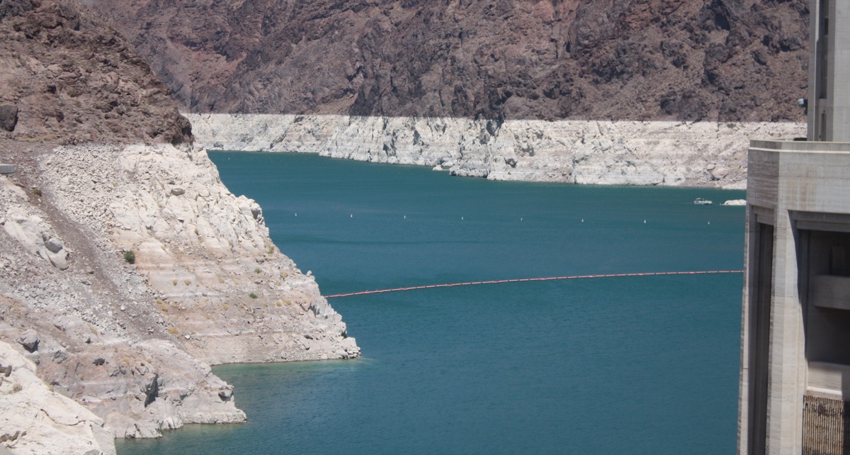 Lake Mead at Hoover Dam showing a broad white bathtub ring on the canyon walls where the water level used to be